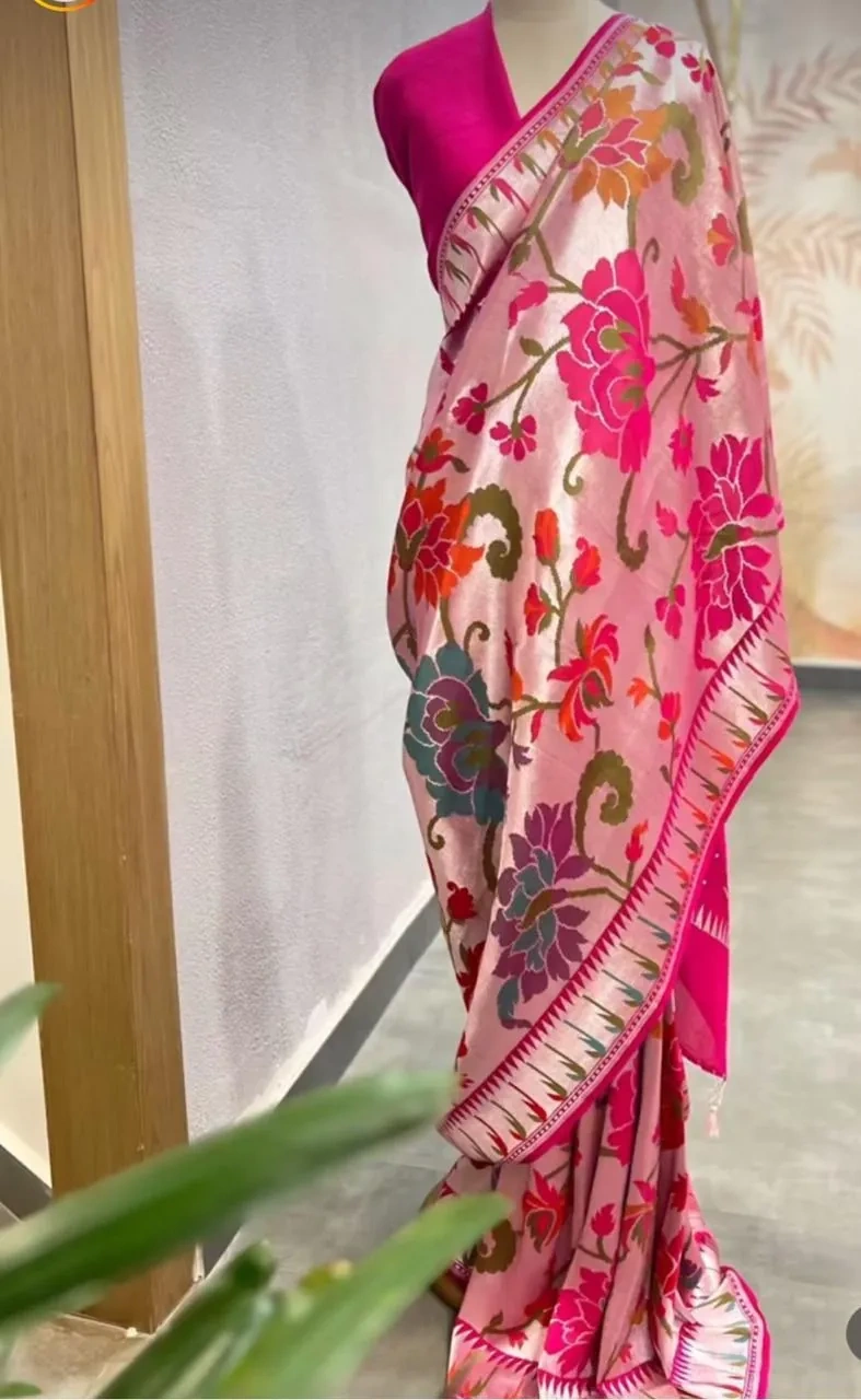 Pure Tussar silk georgette saree in beige with vibrant floral patterns and pink border, ideal for weddings and festivals.