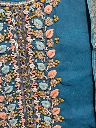 Gold pure Dola silk kurti set featuring intricate pastel floral embroidery and beadwork, paired with a matching dupatta.