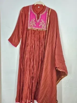 Pure Mul Chanderi silk 3-piece set featuring a golden kurta with pink embroidered yoke, matching dupatta, and bottom.