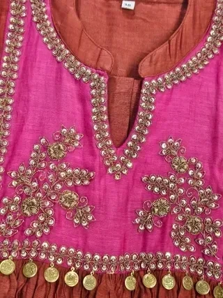 Pure Mul Chanderi silk kurta in golden and pink with intricate gold embroidery, sequin work, and decorative coins.