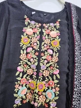 Handcrafted pure muslin lehenga in earthy tones with vibrant floral embroidery, ideal for weddings and festive occasions