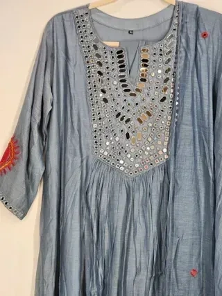 Pastel blue Chanderi silk suit set with mirror work on the neckline, handcrafted for Indian weddings and festive occasions.