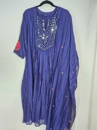 Mul Chanderi silk wedding suit set featuring a pastel blue kurta with mirror work, shimmer dupatta, and fine embroidery details.