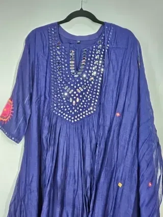 Mul Chanderi silk wedding suit set in pastel purple with mirror work on the kurta, fine embroidery, and shimmer dupatta.