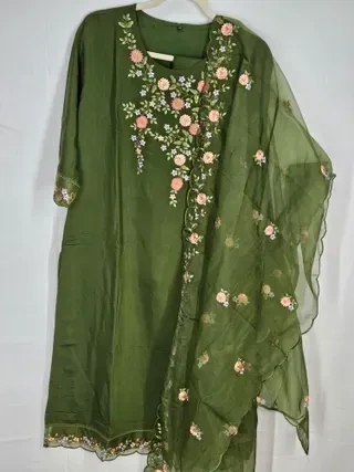 Olive green muslin kurta set with floral embroidery on the neckline and matching embroidered dupatta, elegant festive wear.