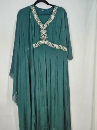 Handcrafted pure Chinon Anarkali gown in deep teal with intricate silver floral embroidery on the neckline and waist.
