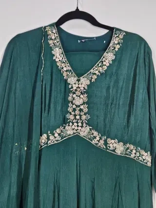 Handcrafted pure chinon Anarkali gown in deep green with intricate gold floral embroidery, perfect for weddings and festive occasions