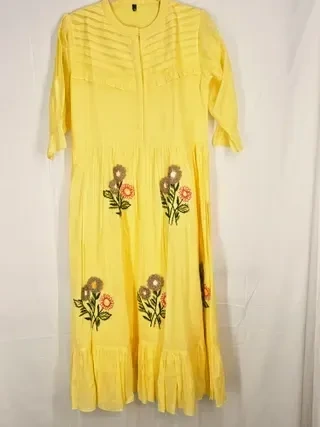 Soft beige pure mul cotton A-line ethnic dress with floral embroidery, three-quarter sleeves, and pleated yoke design