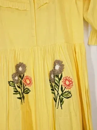Soft beige pure mul cotton A-line ethnic dress with floral embroidery, perfect for Indian weddings and festive occasions