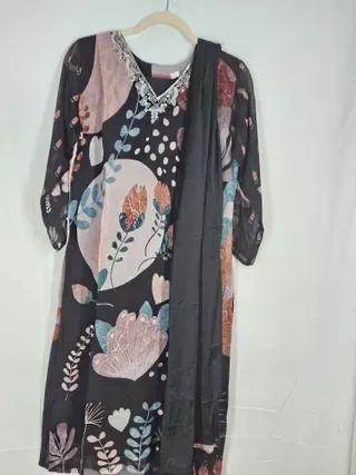 Handcrafted pure georgette lehenga gown with floral embroidery in pink, blue, and beige, paired with a matching dupatta.