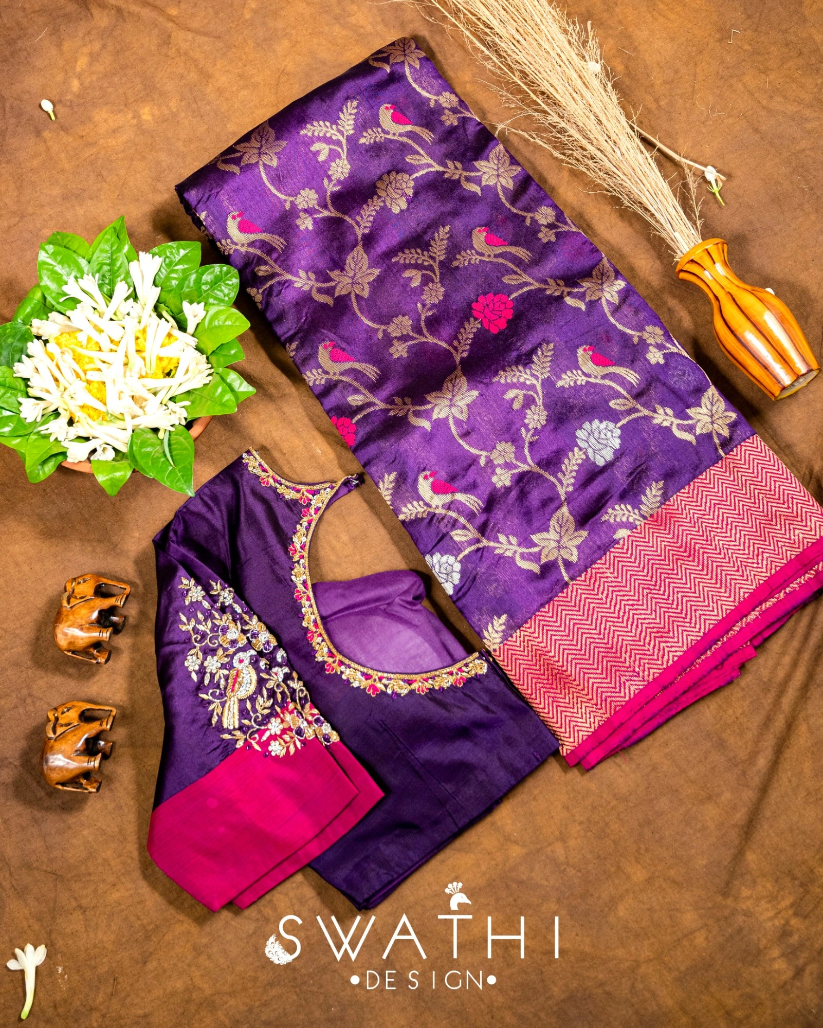 Pure Chanderi silk saree in deep purple with gold and pink floral motifs, paired with a maggam work blouse and red border.