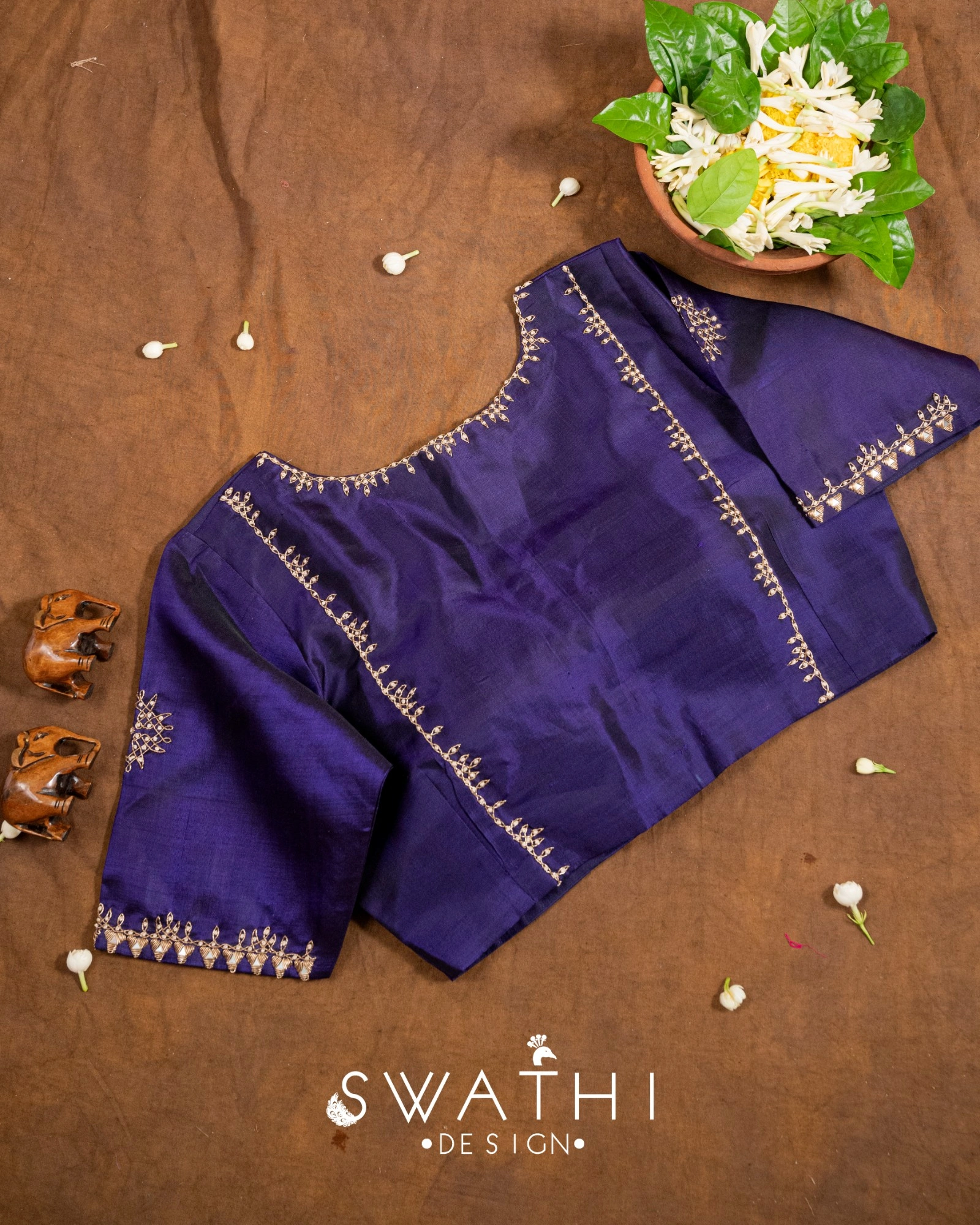 Pure Gadwal silk pattu blouse in deep purple with intricate handcrafted maggam work and gold embroidery detailing.